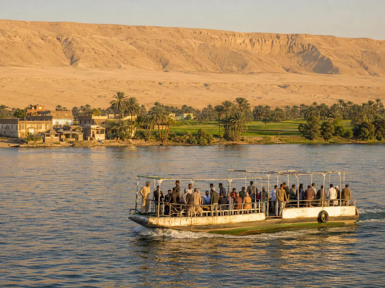 The public ferry crossing to the West Bank, with green farmland on the far shore and the bare ridge standing behind it